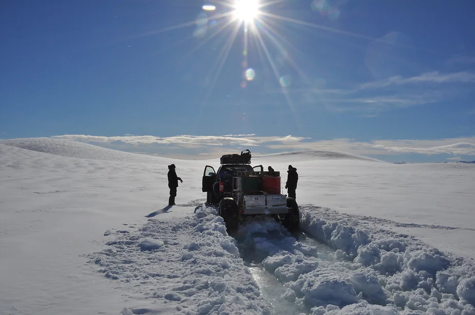 The truck in the sun and snow.