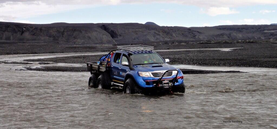 Driving the truck through water.