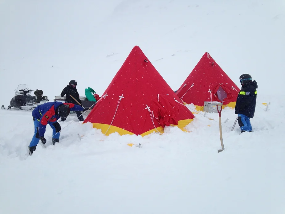 Practicing putting tents together.