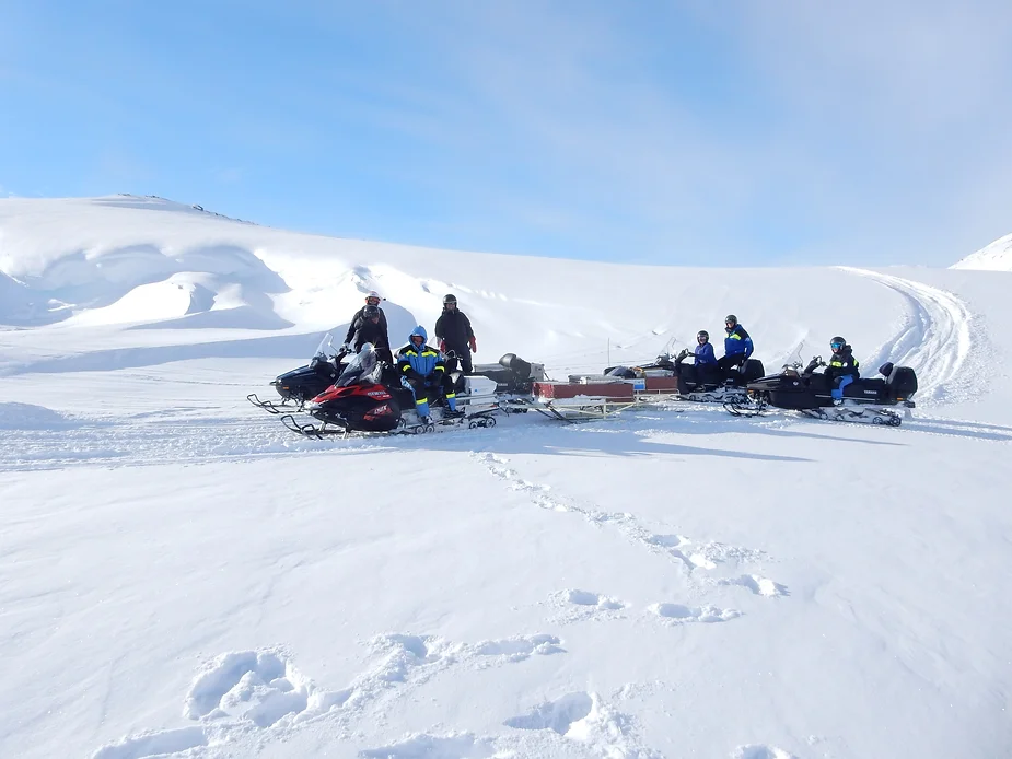 The team training with snowmobiles.