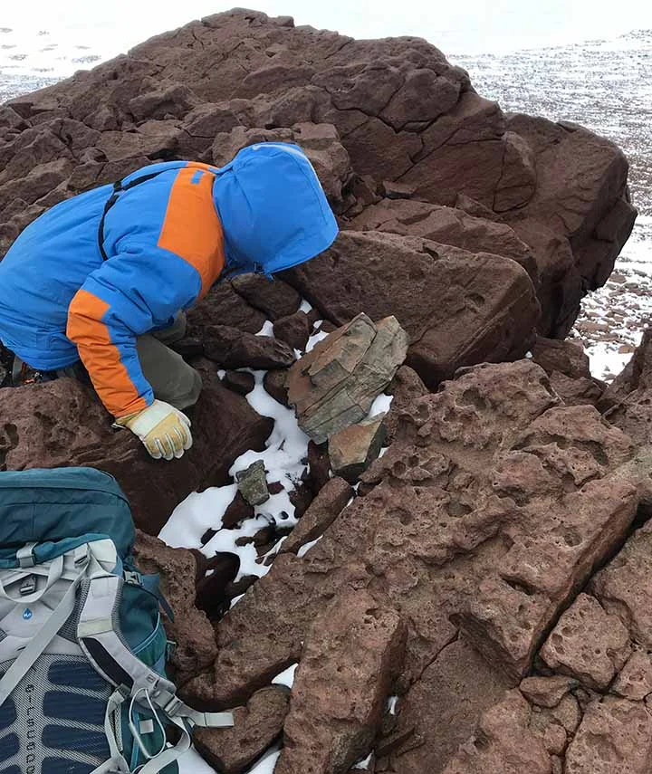 Sampling erratic rock.